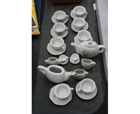 A CHILD'S TOY TEASET WITH TEAPOTS, CUPS, SAUCERS, ETC