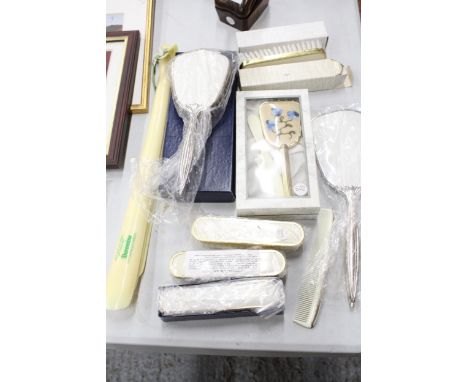 A QUANTITY OF NEW BRUSHES PLUS HAND MIRRORS, A COMB AND THREE LARGE SHOE HORNS