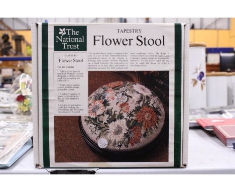 A NATIONAL TRUST TAPESTRY FLOWER STOOL KIT TO INCLUDE AN UPHOLSTERED FOOTSTOOL CANVAS AND TAPESTRY WOOLS