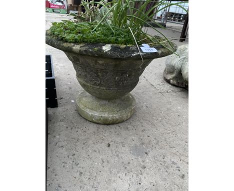 A CONCRETE BOWL PLANTER WITH PEDESTAL BASE