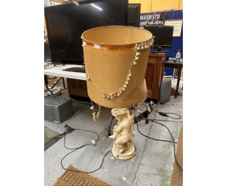 A LARGE CHERUB LAMP BASE WITH SILK LINED SHADE (A/F)