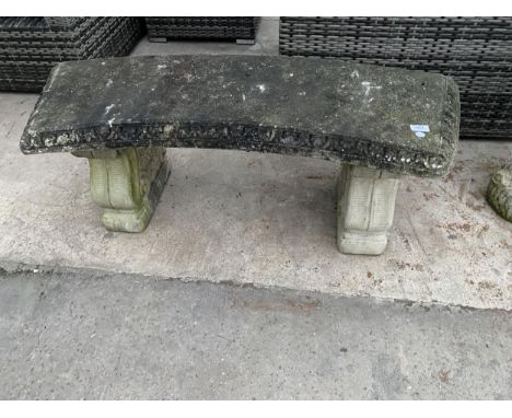 A CONCRETE GARDEN BENCH WITH PEDESTAL BASES