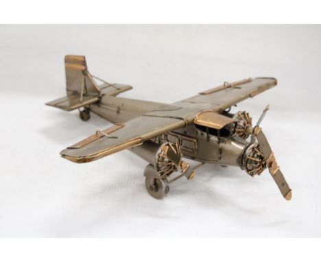 A TIN PLATE THREE ENGINE AEROPLANE