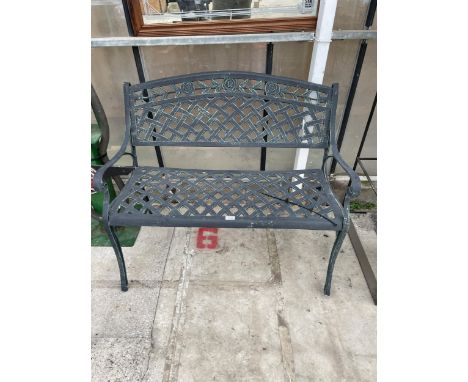 A DECORATIVE METAL TWO SEATER GARDEN BENCH