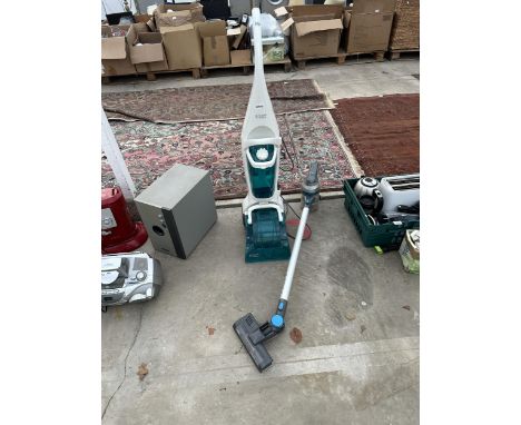A RUSSELLL HOBBS CARPET CLEANER AND A VAX STICK VACUUM
