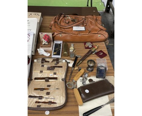 A MIXED LOT TO INCLUDE A FASHION BAG MARKED PRADA, A KNIFE IN A SHEATH, MANICURE SET, WATCHES, COINS, BECKS BOTTLE OPENERS, E