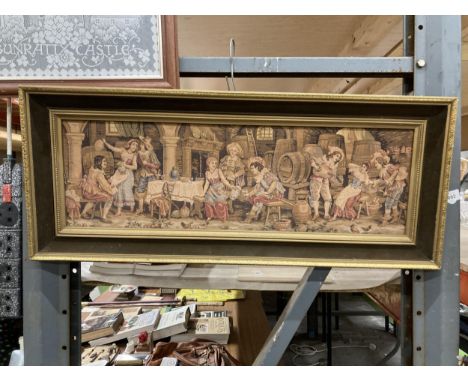 A FRAMED NEEDLEWORK TAPESTRY OF A VINTAGE INN SCENE, 82CM X 34CM