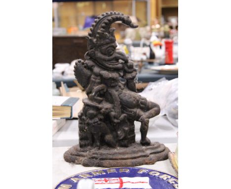 A VINTAGE CAST IRON DOOR STOP FIGURE OF MR PUNCH
