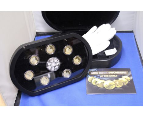 A SEVEN WONDERS OF THE WORLD MEDAL BOX SET TO INCLUDE SEVEN GOLD PLATED AND SILVER PLATED EXAMPLE WITH PRESENTATION BOX, CERT