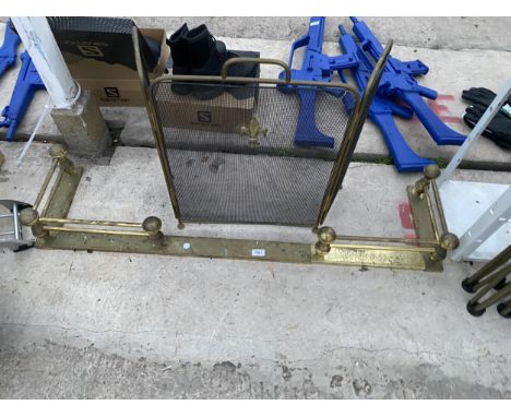A BRASS FIRE FENDER AND A FIRE GUARD