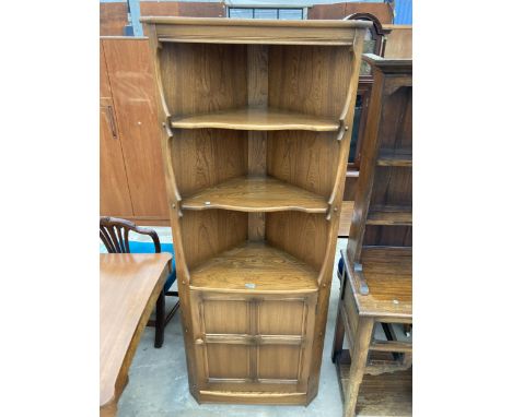AN ERCOL ELM OPEN CORNER UNIT WITH CUPBOARD TO BASE, 30" WIDE