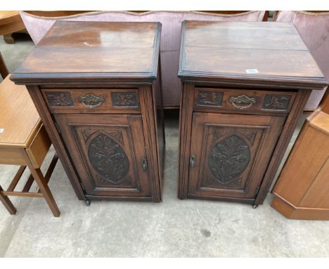 A PAIR OF VICTORIAN STYLE BEDSIDE POT CUPBOARDS WITH CARVED PANEL CUPBOARDS AND DRAWERS, 20" WIDE EACH