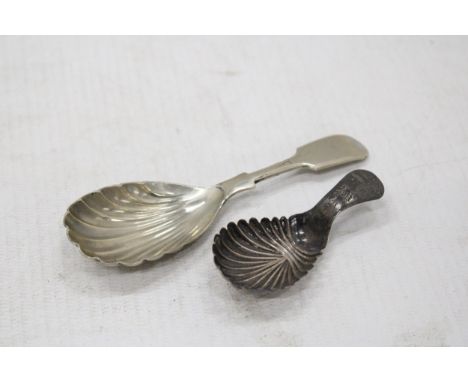 A GEORGIAN SILVER TEA CADDY SPOON TOGETHER WITH A SILVER PLATED EXAMPLE