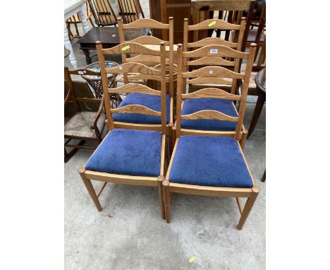 A SET OF FOUR ERCOL GOLDEN DAWN LADDER BACK DINING CHAIRS