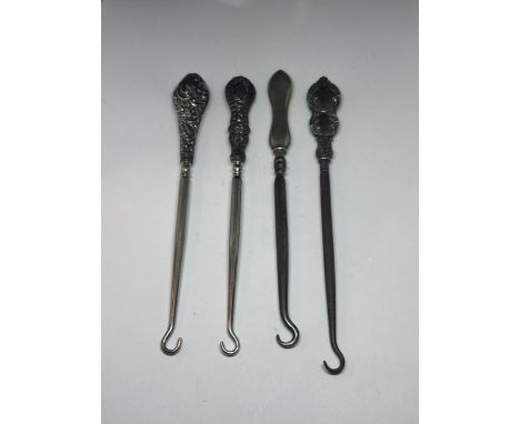 FOUR HALLMARKED BIRMINGHAM SILVER HANDLED BUTTON HOOKS