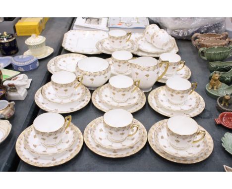 A VINTAGE CARLTON CHINA TEASET TO INCLUDE CAKE PLATES, A CREAM JUG, SUGAR BOWL, CUPS, SAUCERS AND SIDE PLATES