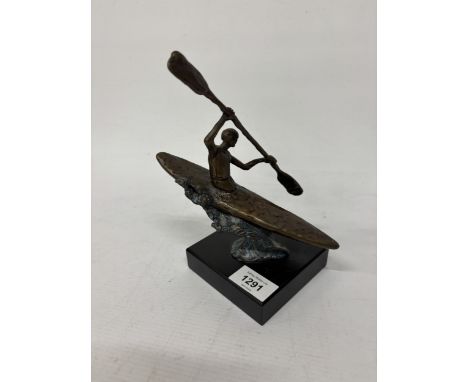 A BRONZE CANOEIST SCULPTURE ON A PEDESTAL