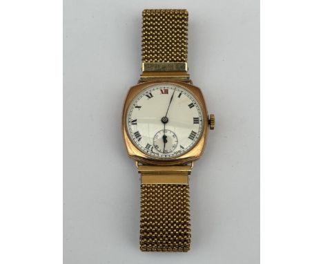 A GENTS 9CT GOLD CASED EARLY 20TH CENTURY HAND WIND WRIST WATCH ON A GOLD PLATED ELASTICATED STRAP, WORKING AT THE TIME OF CA
