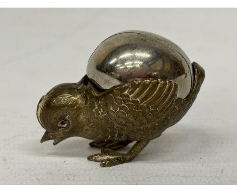 A VINTAGE HATCHING CHICK BRASS PIN CUSHION