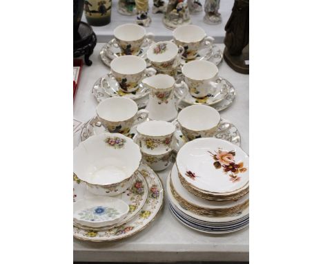 A QUANTITY OF CHINA TEAWARE TO INCLUDE CUPS, SAUCERS, SIDE PLATES, ETC