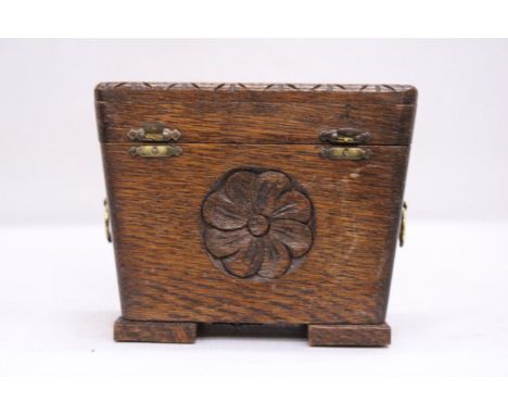 AN ARTS AND CRAFTS STYLE OAK MUSICAL TEA CADDY