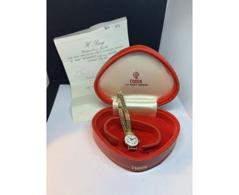 A LADIES GOLD TUDOR ROLEX WATCH WITH 9 CARAT GOLD STRAP IN ORIGINAL PRESNTATION BOX WITH ORIGINAL RECIEPT FROM 27.1.68 GROSS 