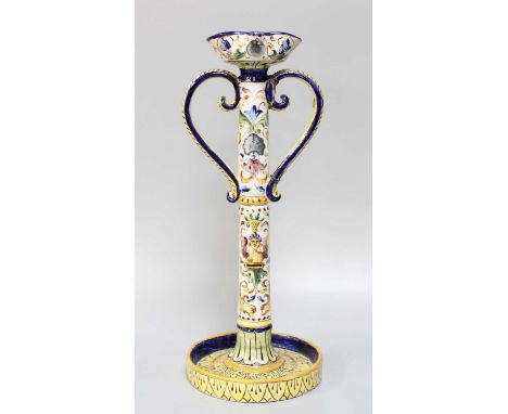 A 19th Century Continental Faience Candlestick, 39cm high