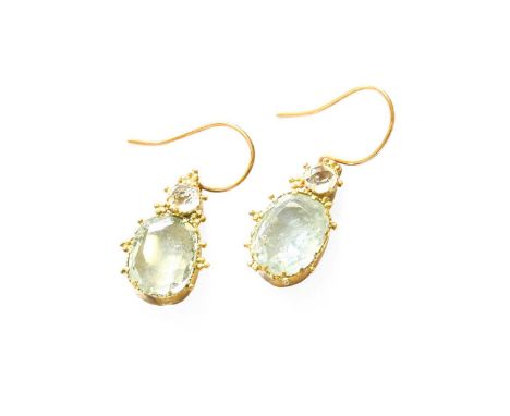 A Pair of Aquamarine Drop Earrings, the cushion cut aquamarine surmounted by a rose cut colourless stone, in yellow claw sett