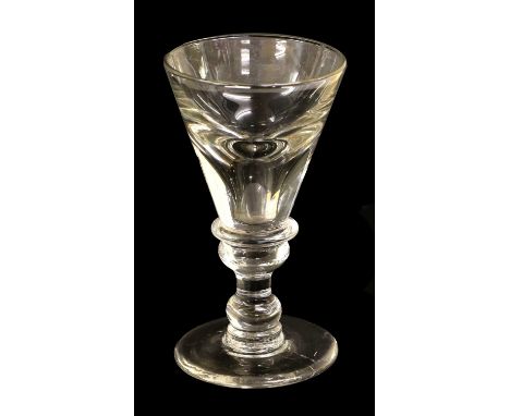 A Toastmaster's Glass, circa 1740, the deceptive funnel bowl with basal annular knop, on double ball-knop stem and circular f