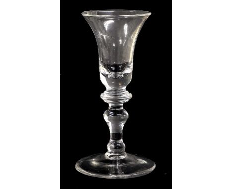 A Wine Glass, circa 1740, the bell-shaped bowl with annular basal knop on a baluster stem and circular foot, 15.5cm highLight