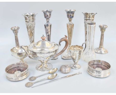 A Collection of Assorted Silver, including a three-piece tea-service, each with castellated border; a pair of vases, filled; 