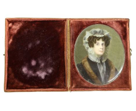 Teresa Fioroni (Italian, 1799-1880): Miniature Portrait of a Lady, bust length, wearing a lace cap and collar and a fur jacke