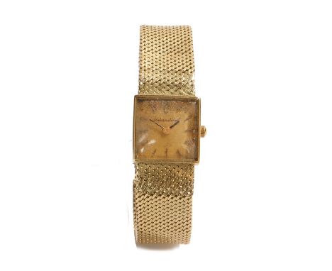 International 18 carat gold ladies wristwatch, the signed gilt engine turned dial with baton numerals, quartz movement, the c
