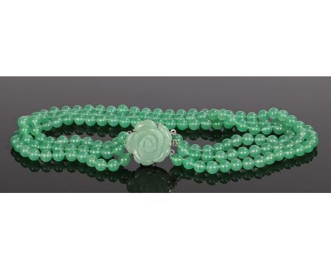 Jade necklace, with a flower head clasp and three bead strands, 45cm long