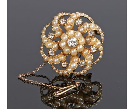 18 carat gold pearl and diamond brooch, the brooch with a central diamond and star swirl surround set with further pearls and