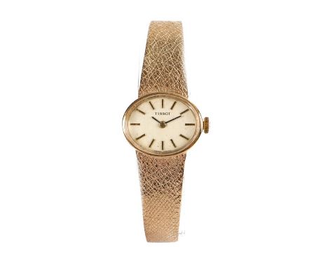 Tissot 9 carat gold ladies wristwatch, the signed cream dial with baton numerals, manual wound the case 21mm wide, on a 9 car