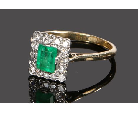 18 carat gold emerald and diamond set ring, with a central emerald with diamond surround, ring size P