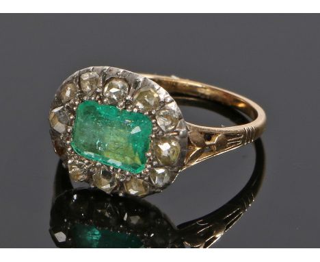 19th Century emerald and diamond set ring, the central, emerald cut, emerald with a diamond surround, ring size F 1/2