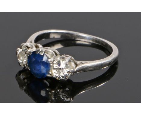 Sapphire and diamond set ring, the central sapphire flanked by a round cut diamond to either side, ring size K 1/2