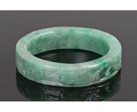 Jade bangle, carved with leaf scrolls, 7.5 diameter 