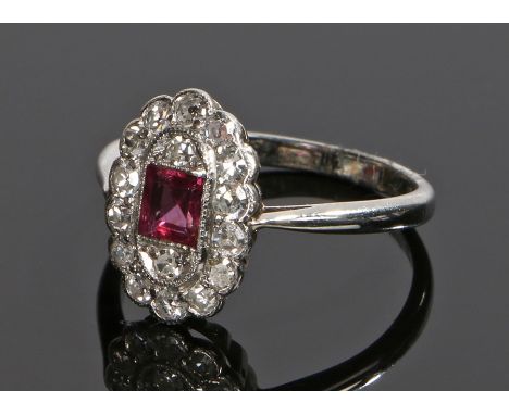 18 carat white gold ruby and diamond set ring, with a central square cut ruby and diamond surround, ring size M