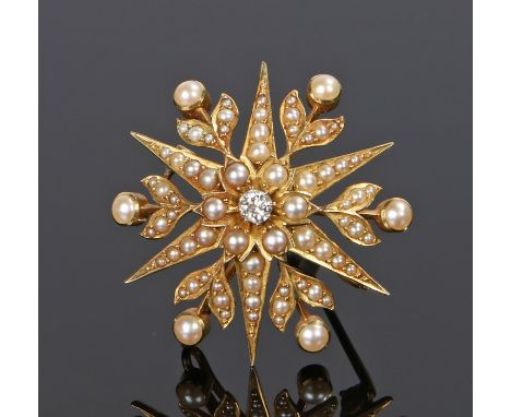 Diamond and pearl set star brooch, with a central diamond and pearl surround, pearl set burst and flowers, 37mm diameter 