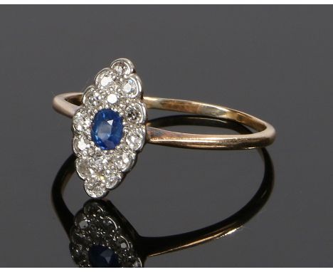 Sapphire and diamond set ring, of navette form with a central sapphire and diamond surround to the yellow metal shank, ring s