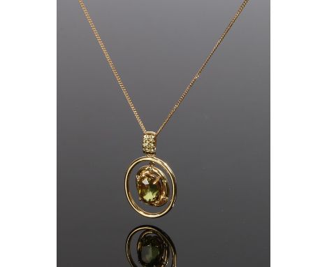 18 carat gold sphene and yellow diamond pendant necklace, with a central sphene with a diamond surround and further diamonds 