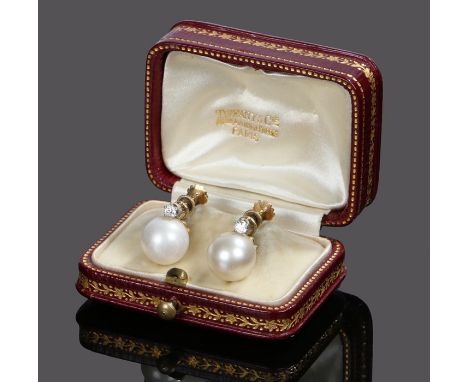 Pair of diamond and pearl earrings, the pearls at approximately 9mm in diameter with a round cut diamond above