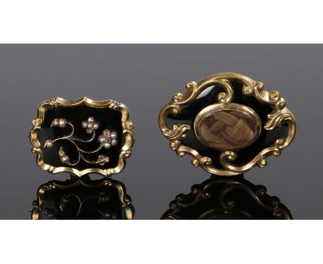 Two Victorian mourning brooches, the first with an inscription for William Neale dated for 1857, the second with pearl set fl