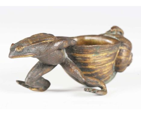 A late 19th century Continental gilt patinated cast bronze novelty model in the form of a frog pulling a shell, length 11cm.