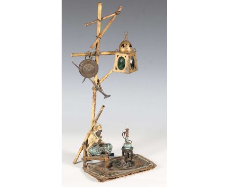 Franz Xavier Bergman - an early 20th century Austrian cold painted cast bronze figure of an Arabian man seated on a chair bel