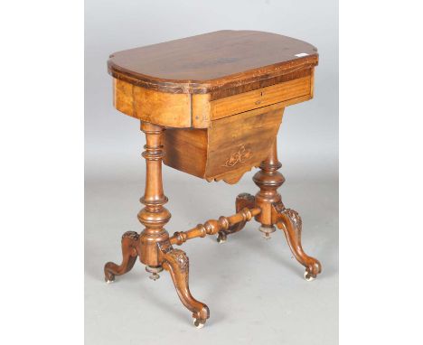 A late Victorian walnut fold-over games/work table, the hinged top inlaid with chess, cribbage and backgammon boards, height 