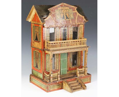 A late 19th century German softwood model of a two-storey doll's house by Moritz Gottschalk, the exterior covered in lithogra